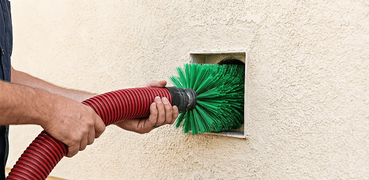 Air duct cleaning brush removing debris from a vent opening in Henderson, NV