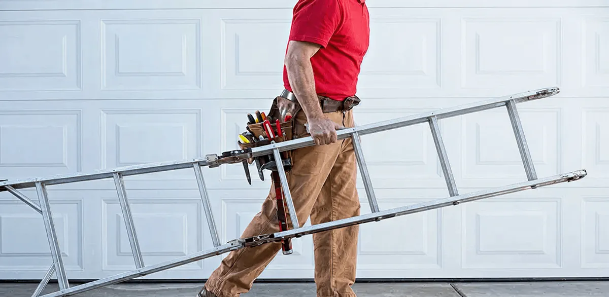 Garage door repair technician arriving with tools and ladder in Henderson, NV