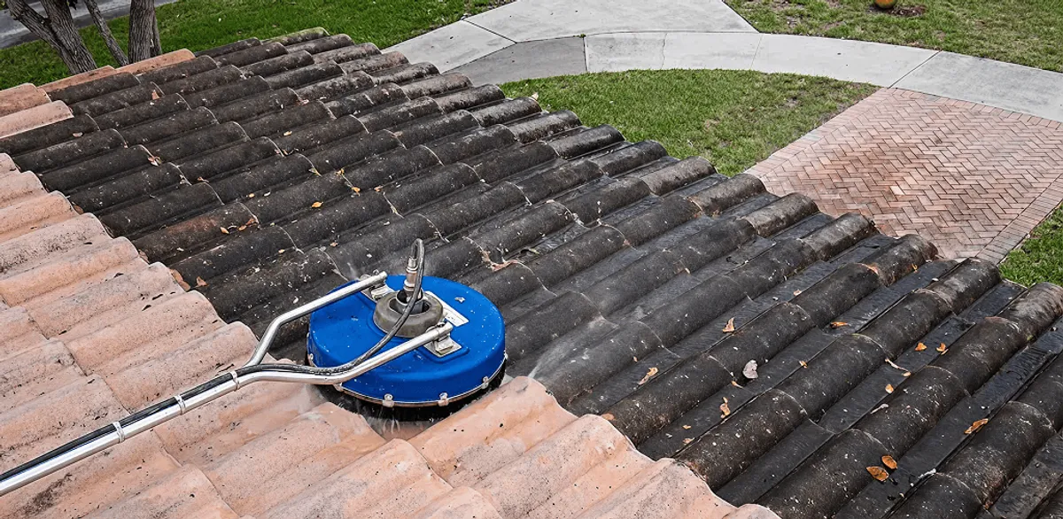 Roof pressure cleaning removing debris and buildup from roof tiles in Henderson, NV