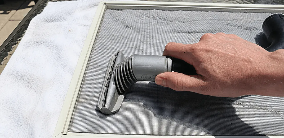 Window screen repair cleaning and fixing a damaged screen mesh in Henderson, NV